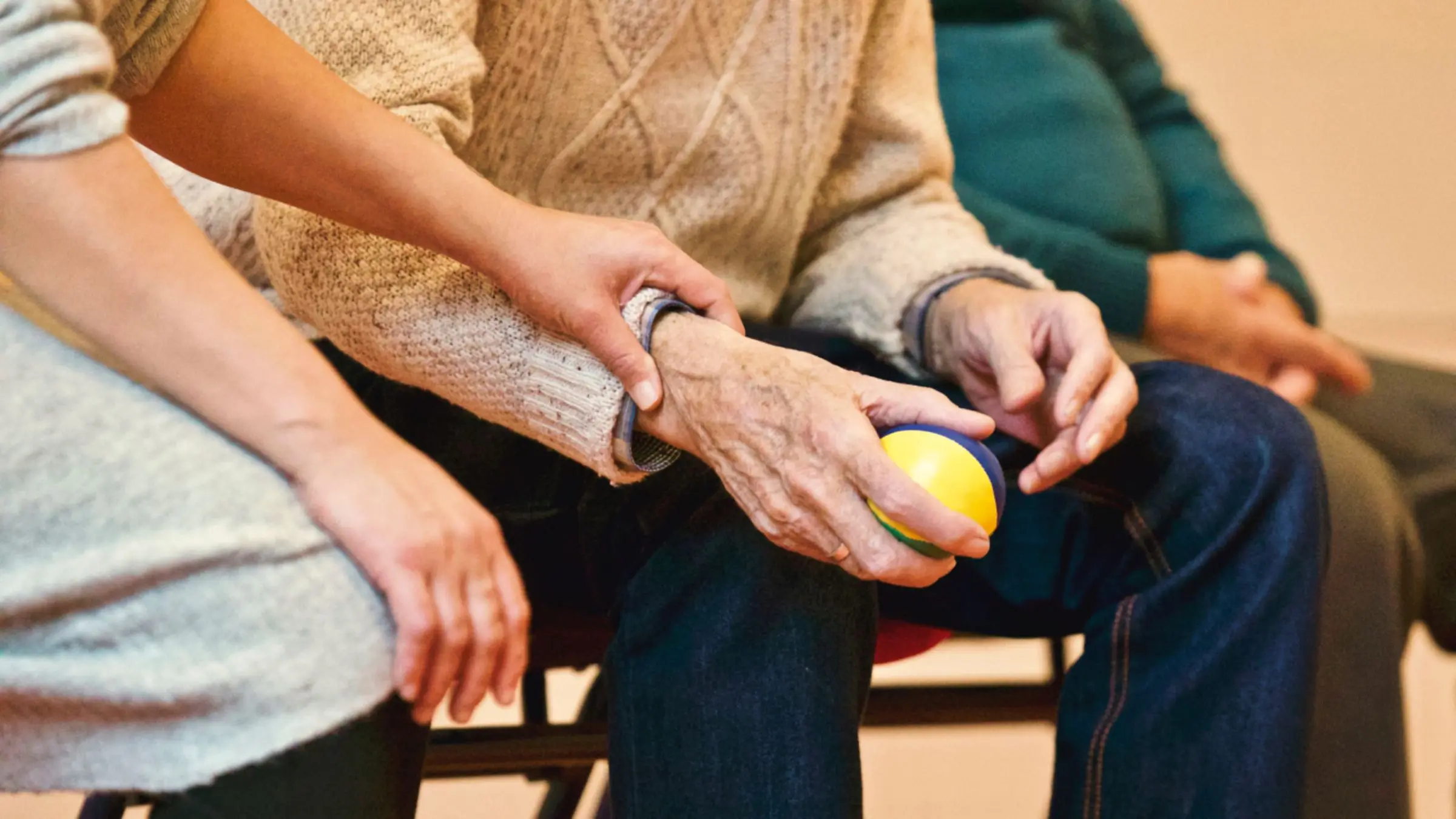A physician speaking with a patient in an exam room